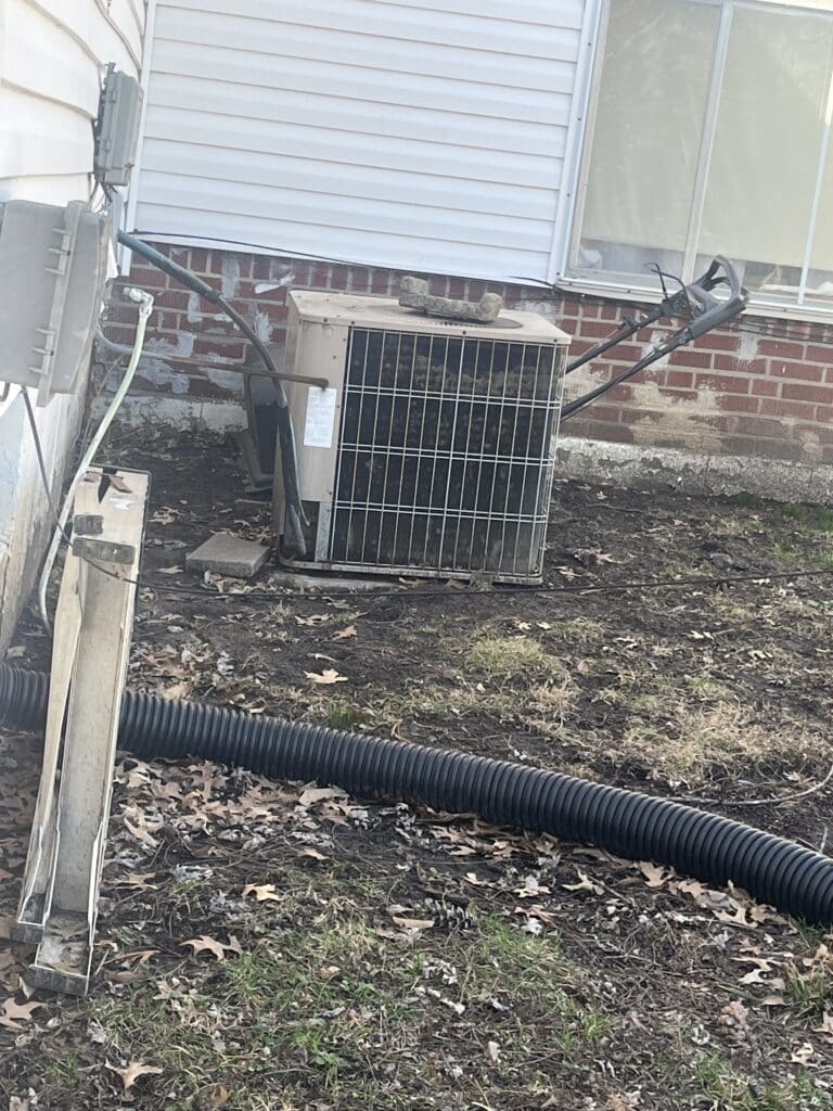 Outdoor AC repair service on residential unit in Florissant, MO.