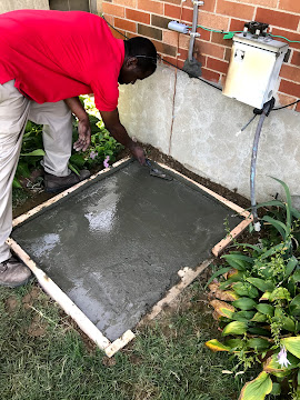 Technician servicing rooftop HVAC unit in Hazelwood, MO.