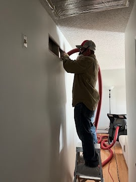 Air duct cleaning service inside home in Old Town, MO.