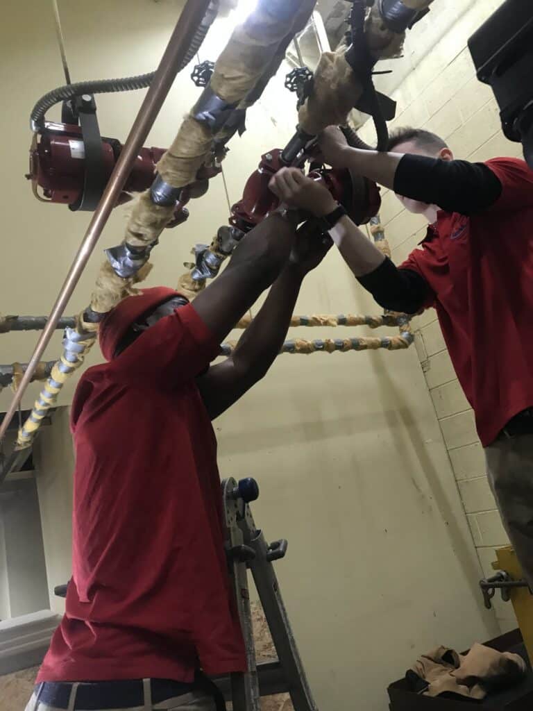 Technician performing heating installation in Florissant MO